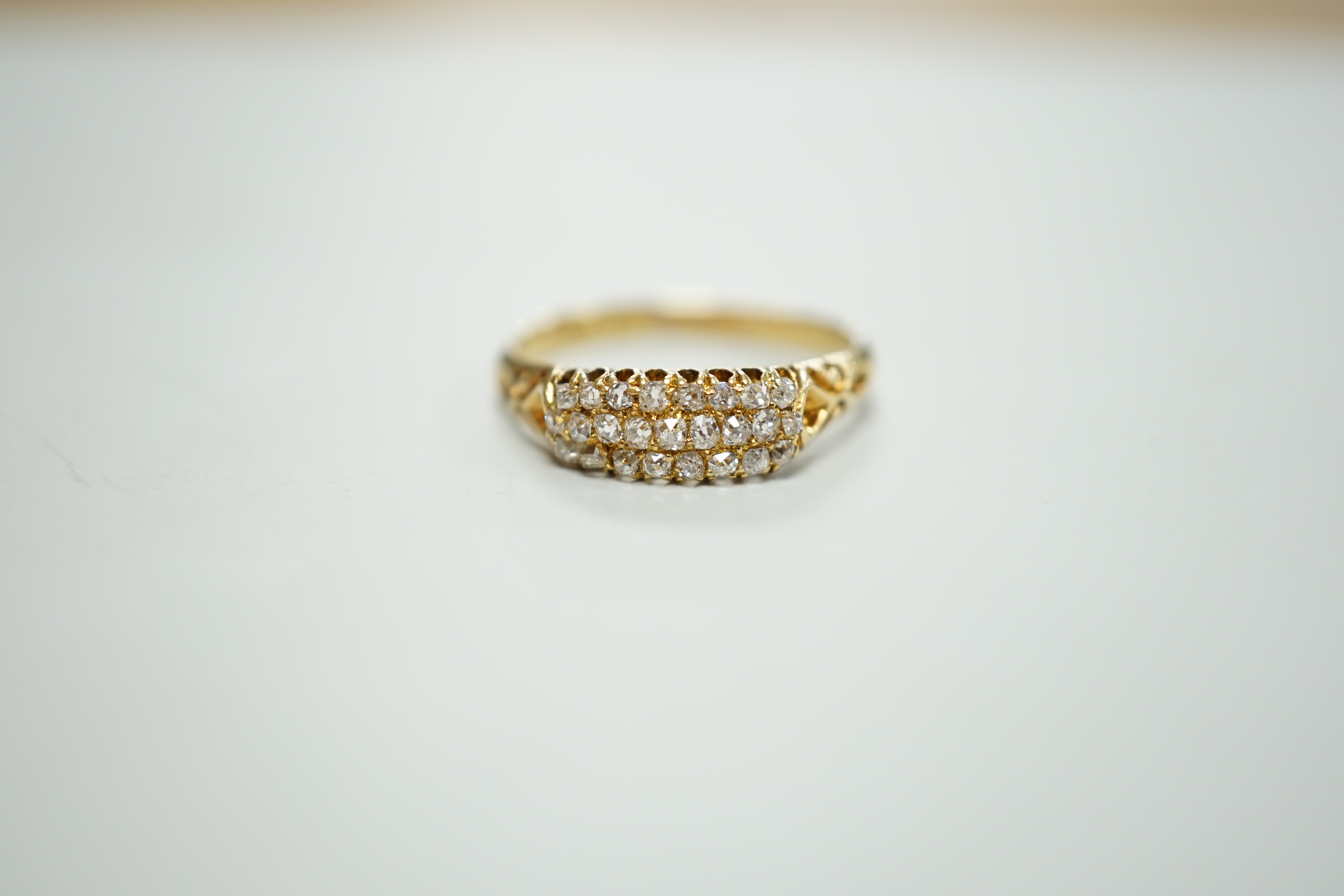 An 18ct and three row diamond cluster set ring, size P/Q, gross weight 3 grams.